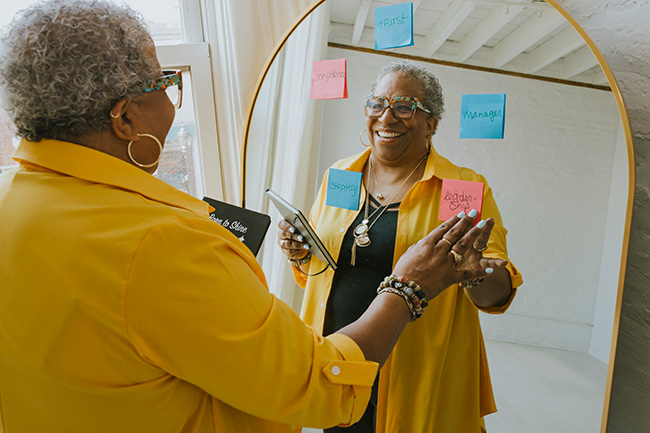 dr bonnie strategy session showing her appoach looking in mirror with post it notes.